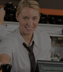 Cashier behind a register