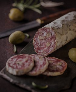 Specialty food, cured meat sliced on a board