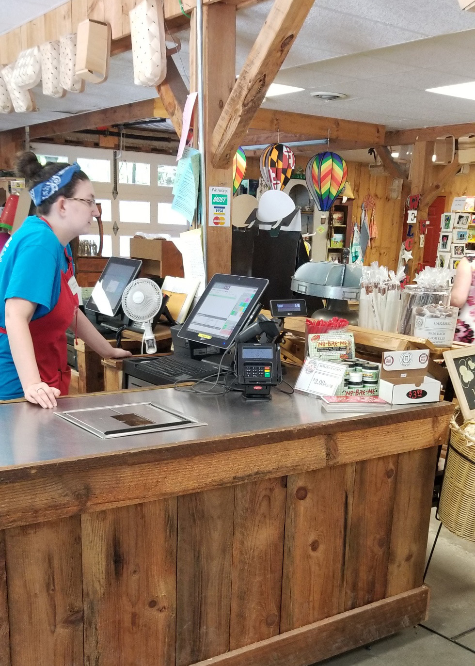 Point of Sale at Destination Farmer's Markets with a employee turned facing it